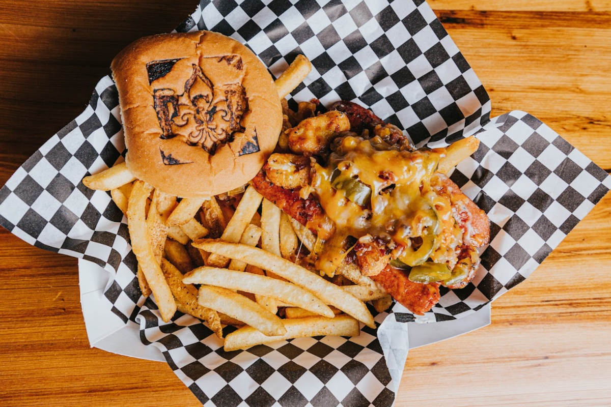 Grilled meat, melted cheese, salad and fries, pastry on the side